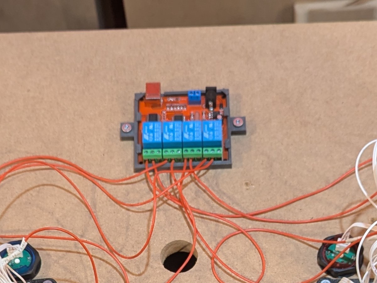 Custom 3D-printed bracket securing a relay board in an operating control system