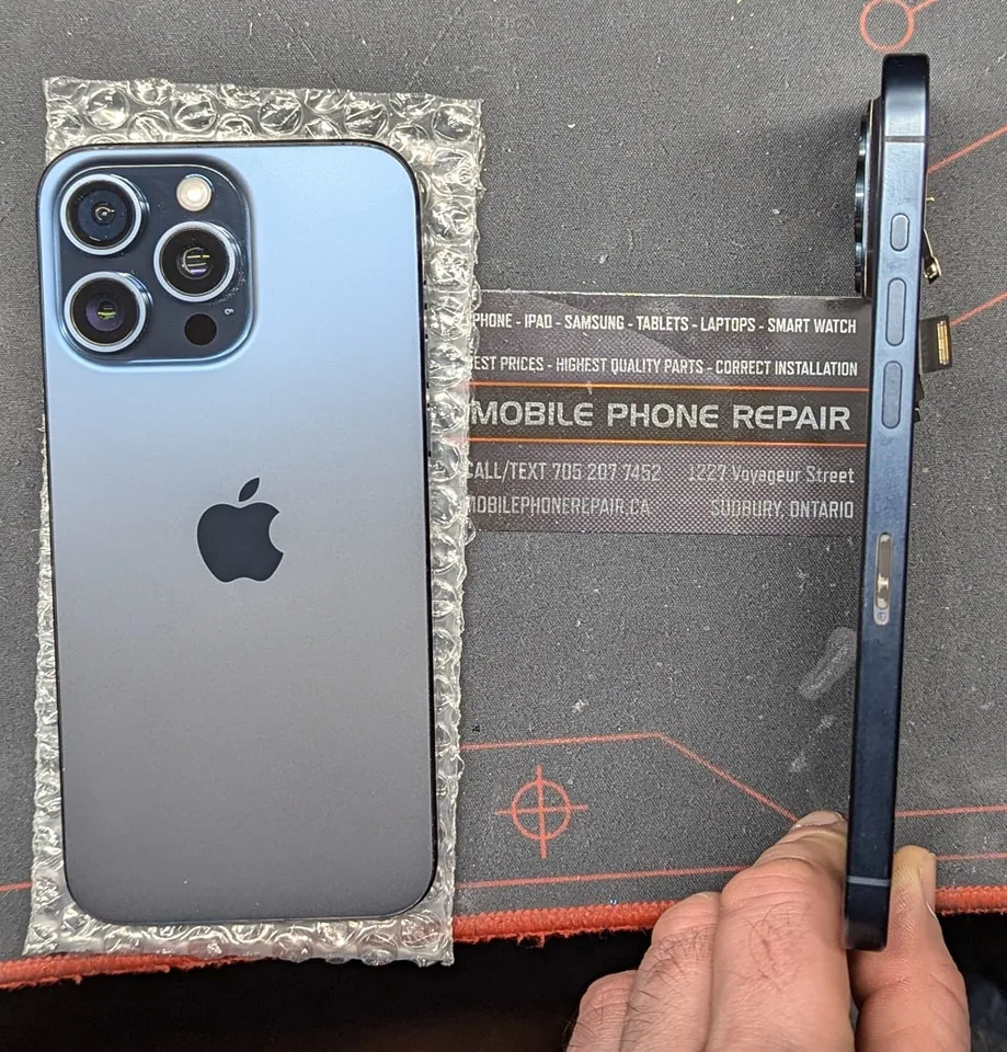 Phone repair bench with tools and parts